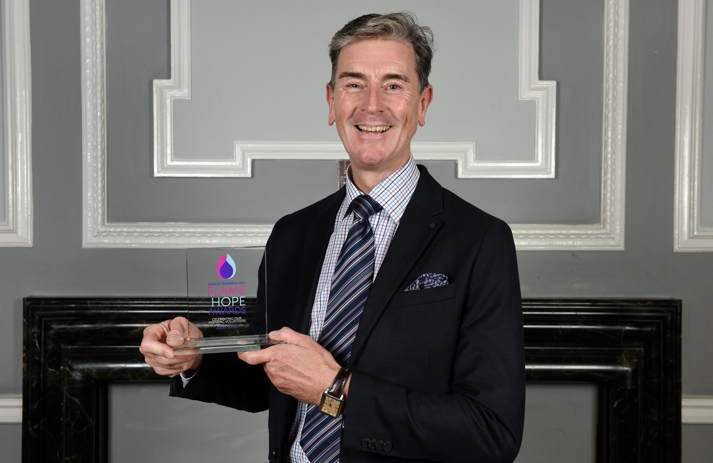 Cancer Research UKs Flame of Hope awards. Stephen Owen with his award. Picture by Paul Heyes.