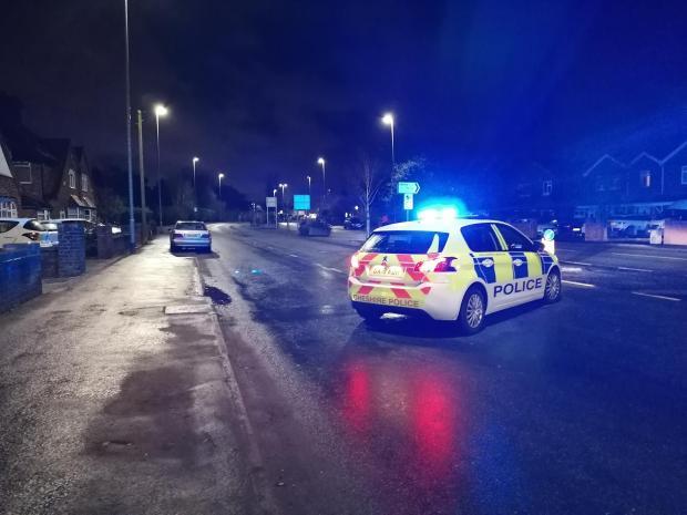 Police on Warrington Road following the fatal collision