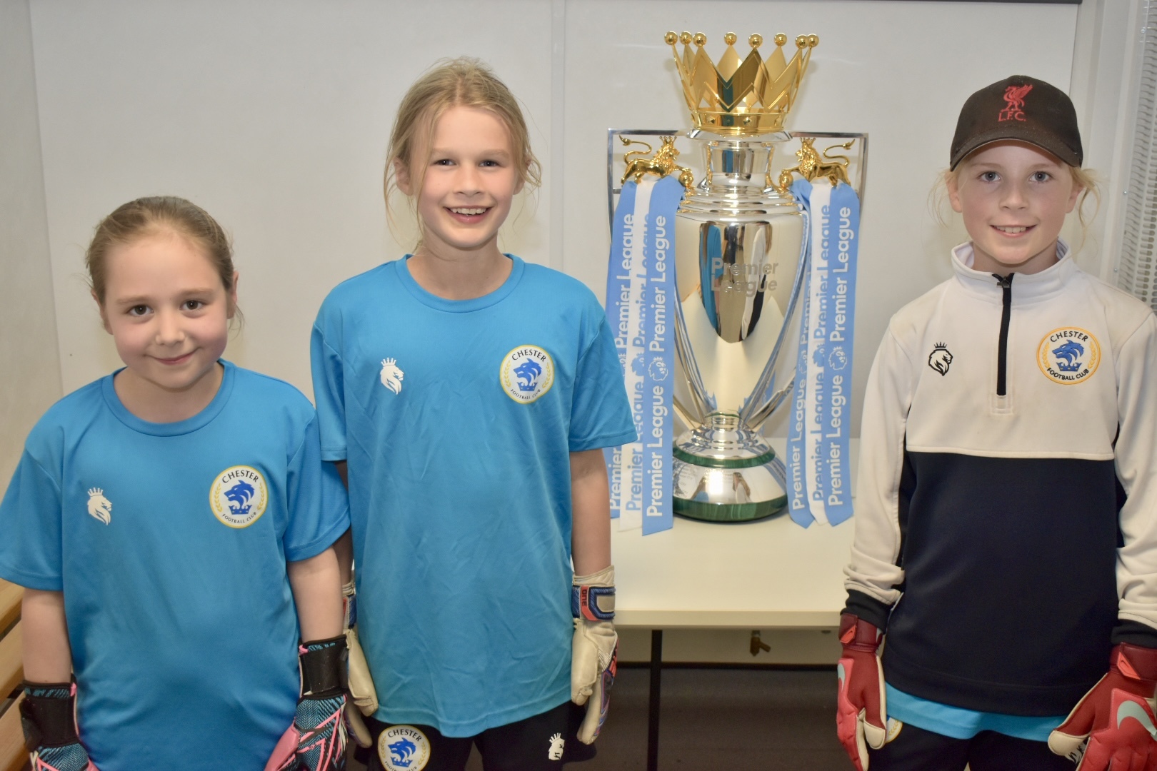 Players and families enjoyed their chance to be pictured with the Premier League trophy and the UEFA Womens Euro trophy at Chester FC Girls Emerging Talent Centre.