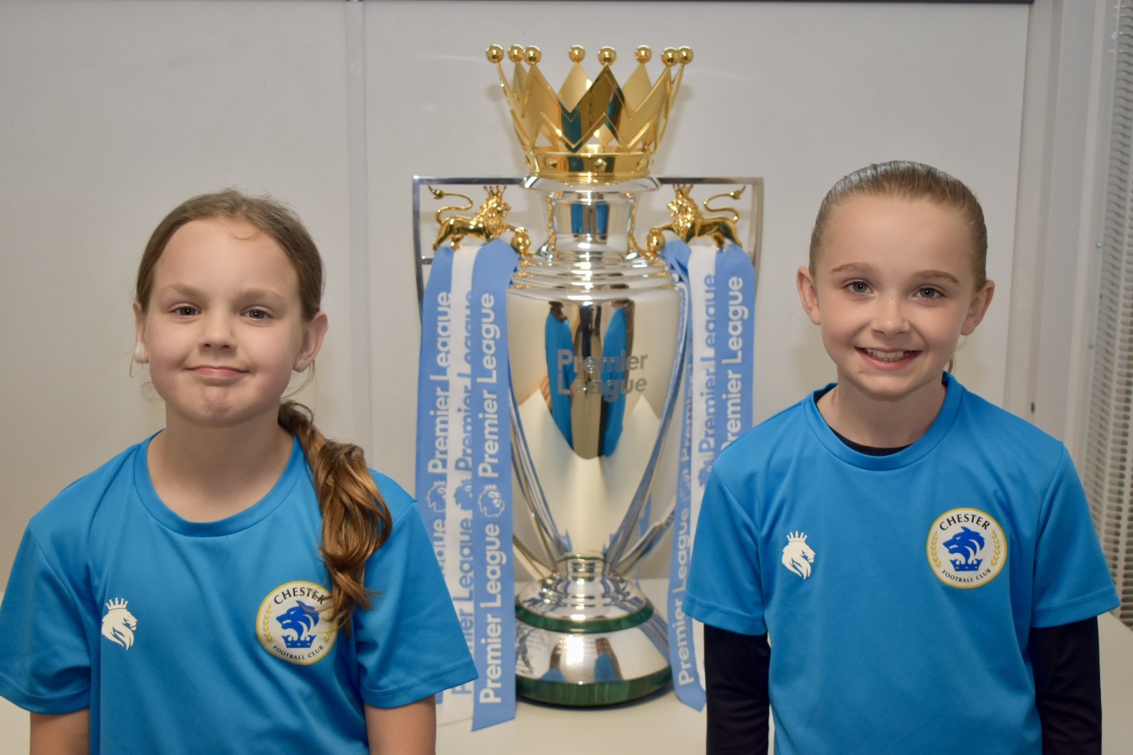 Players and families enjoyed their chance to be pictured with the Premier League trophy and the UEFA Womens Euro trophy at Chester FC Girls Emerging Talent Centre.