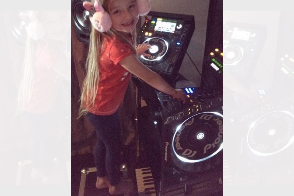 Tayha learning her DJ skills as a small child.