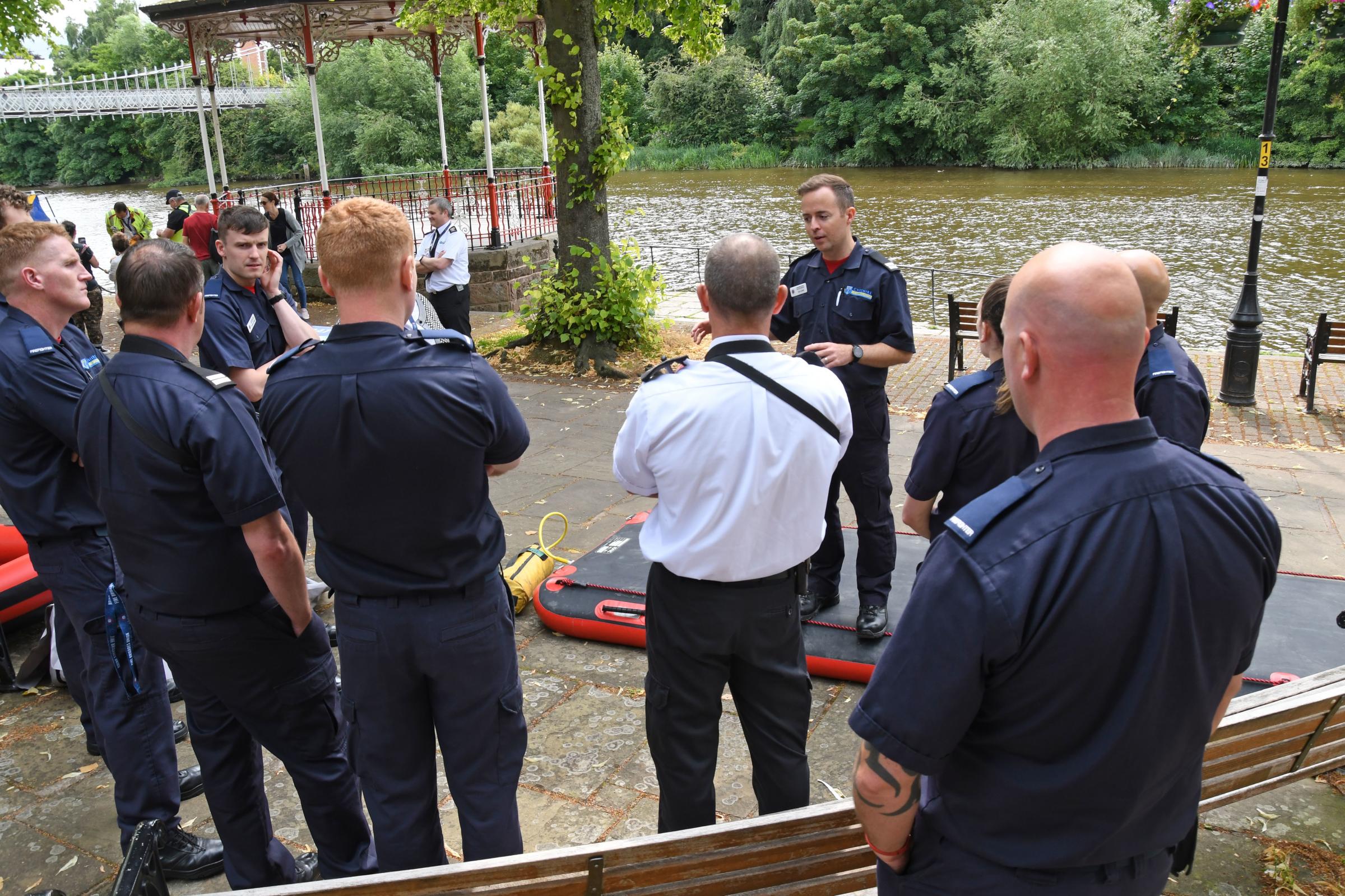 Firefighters get the briefing for the day.