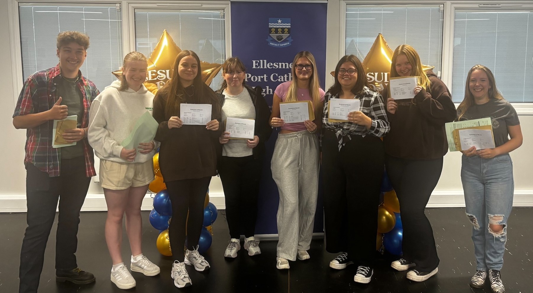 Ellesmere Port Catholic High School students celebrate their A-level results.