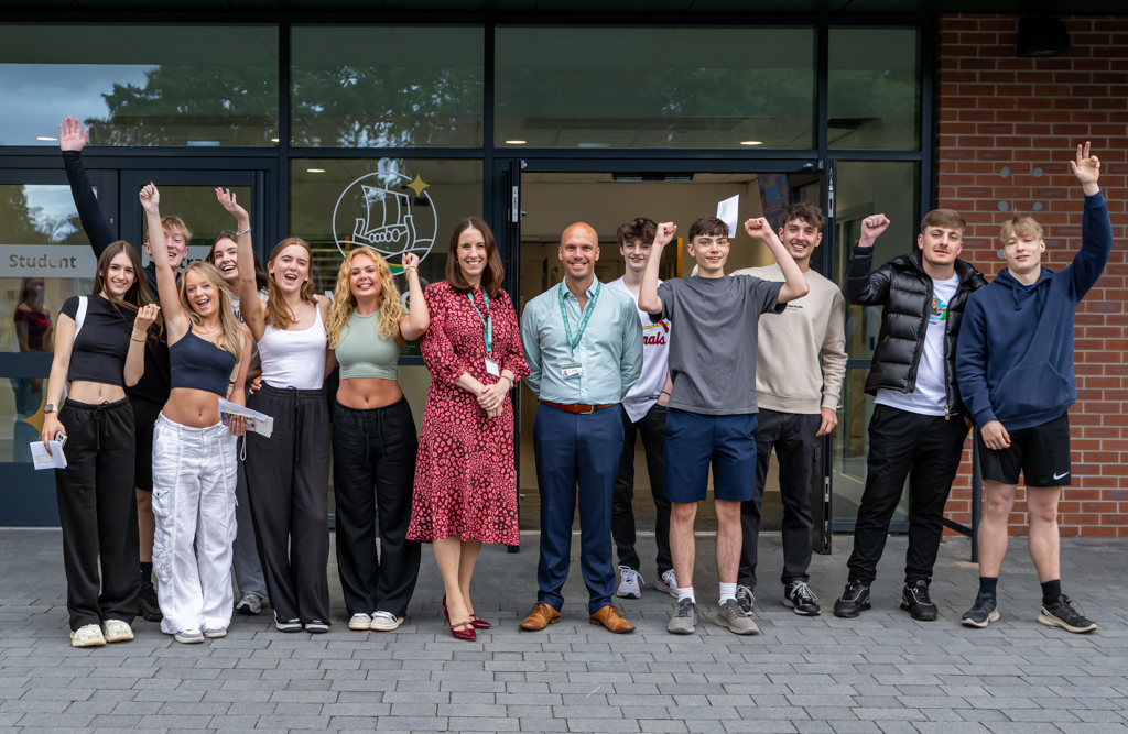 Neston High School students celebrate their A-level results.