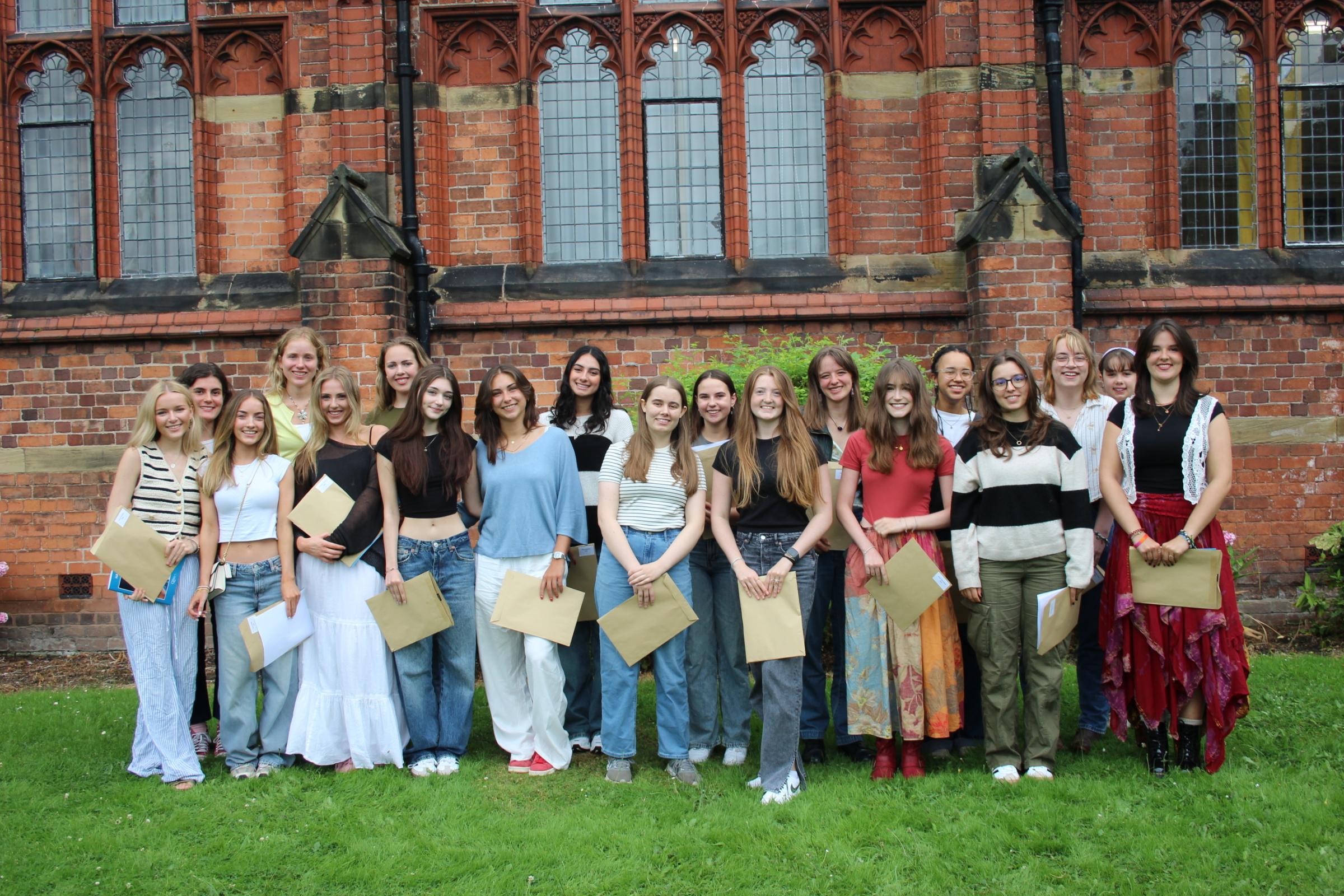 Queens School girls celebrate outstanding A-level results.