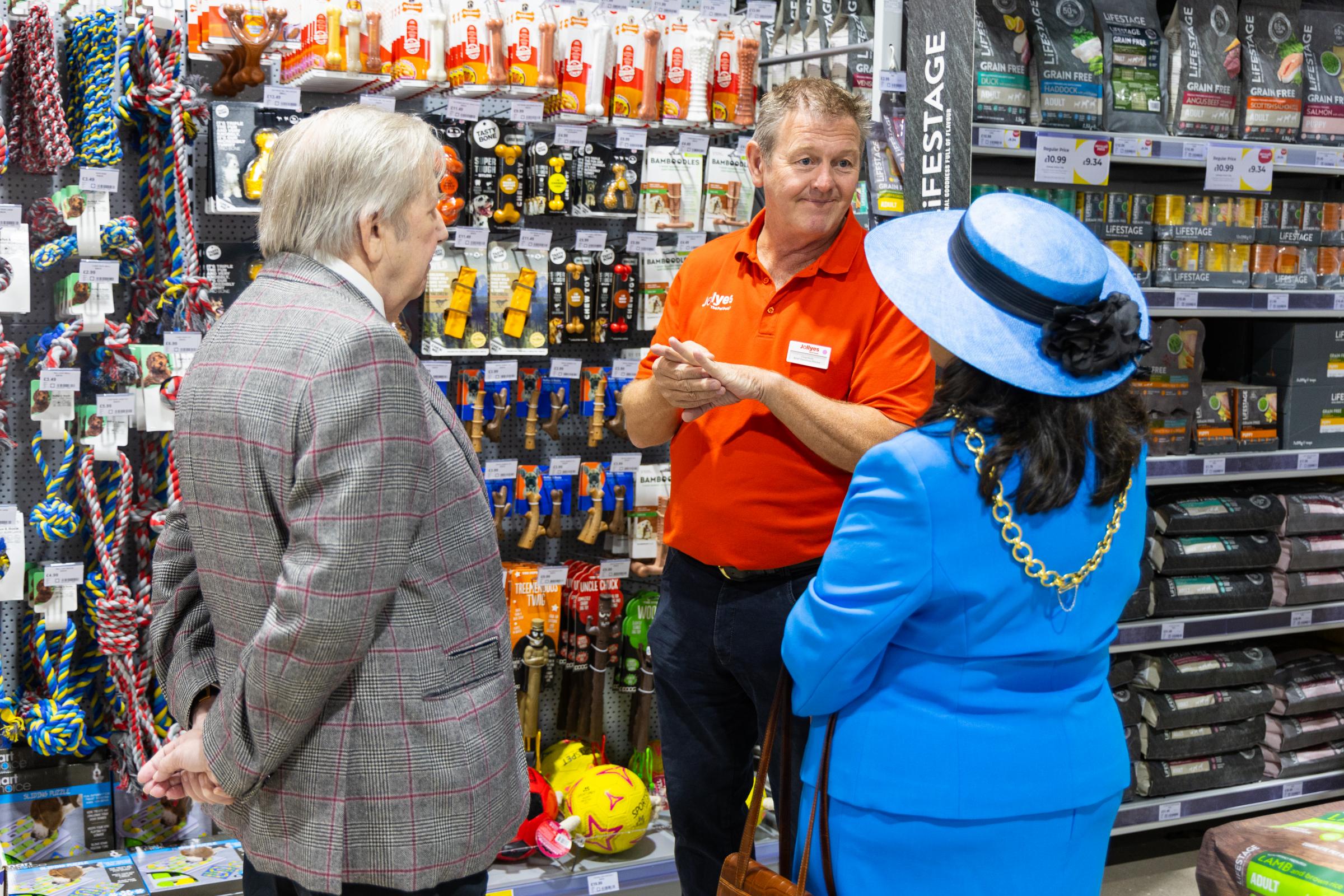 Celebrating the opening of the new Jollyes store were Lord Mayor of Chester, Cllr Razia Daniels and border force detector dog Sully and his handler Olivia Uguz who bit through a string of sausages to declare the store open