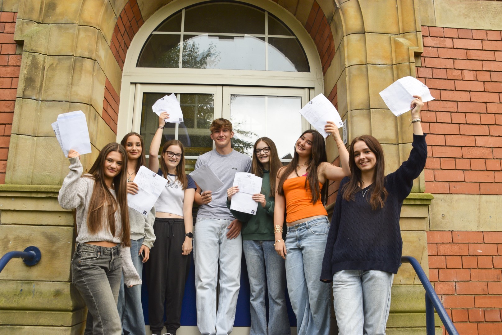 Queens Park High School students celebrating their GCSE results.