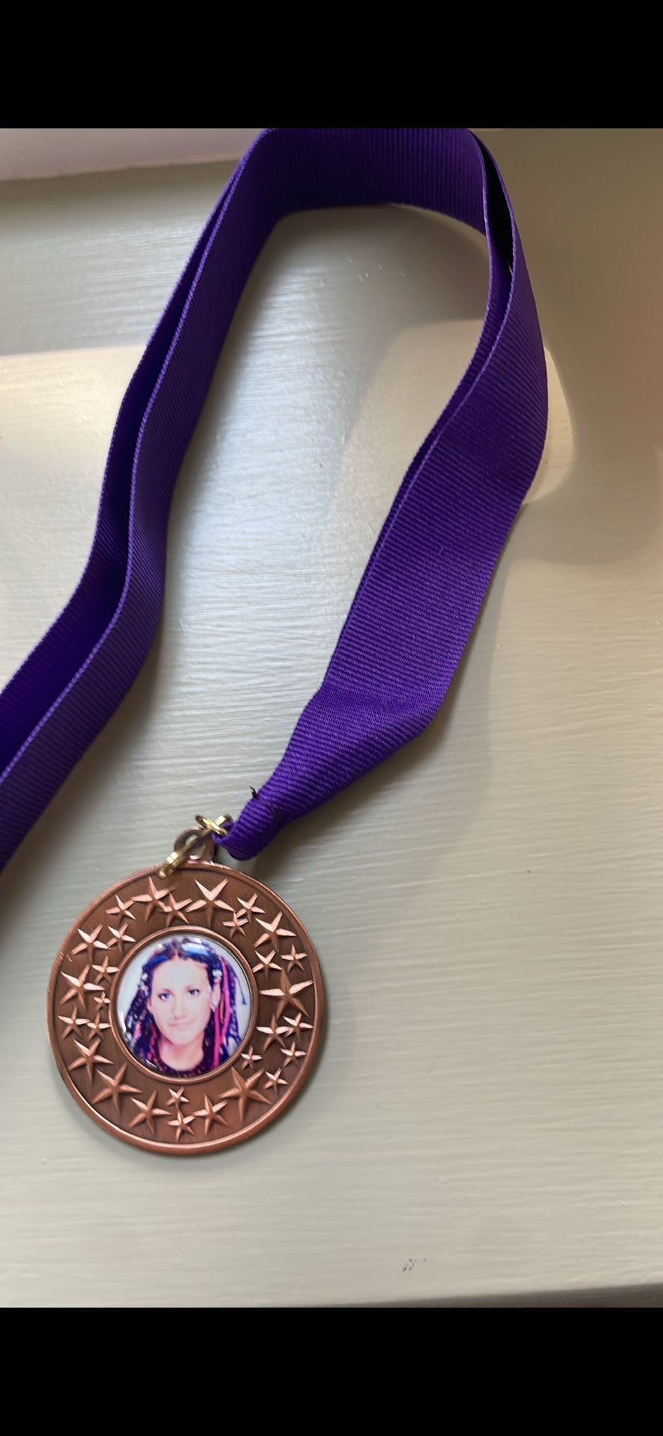 People who join John for part of the running challenge will receive a medal with a picture of Michelle Jennings on it.