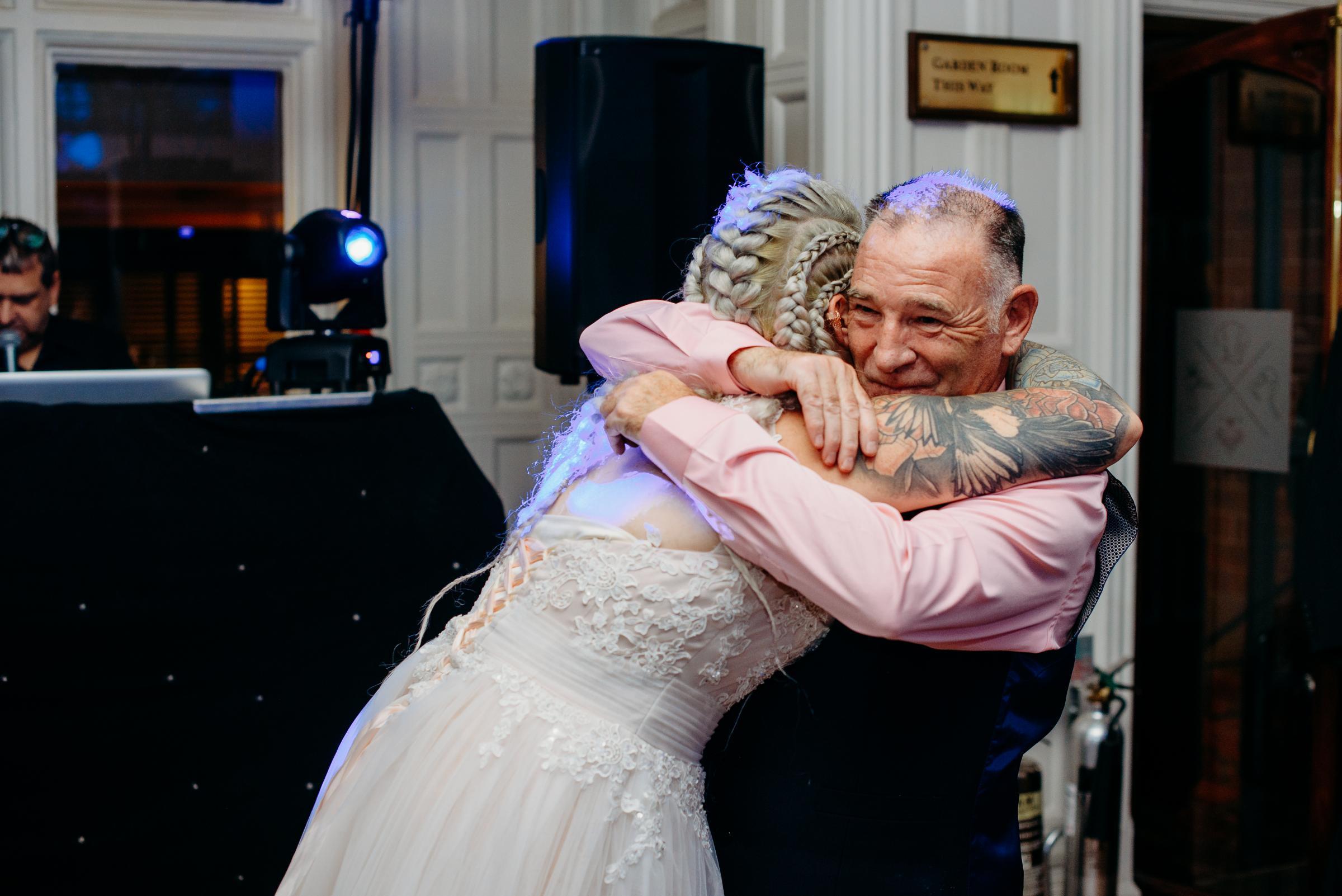 Father-daughter dance, with Jessica Solari hugging Paul Simpson whilst dancing to Youll Never Walk Alone.